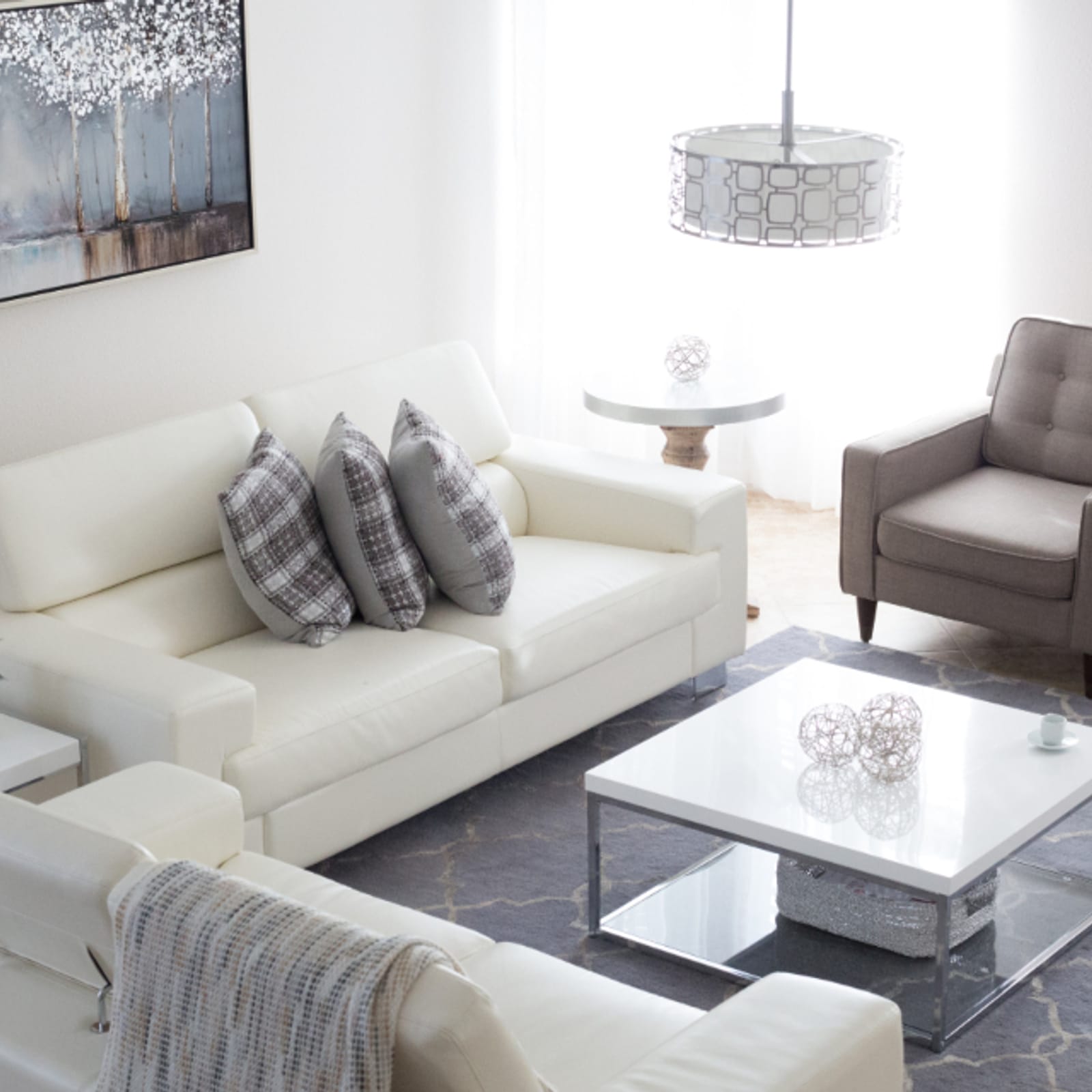 A bright, tidy living room reset to a guest-ready standard